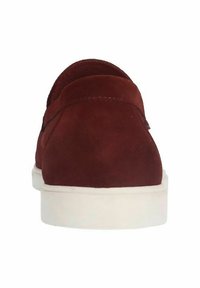 Red suede sneakers with a smooth texture, white rubber sole, and simple design. Features a rounded heel and minimal stitching detail.