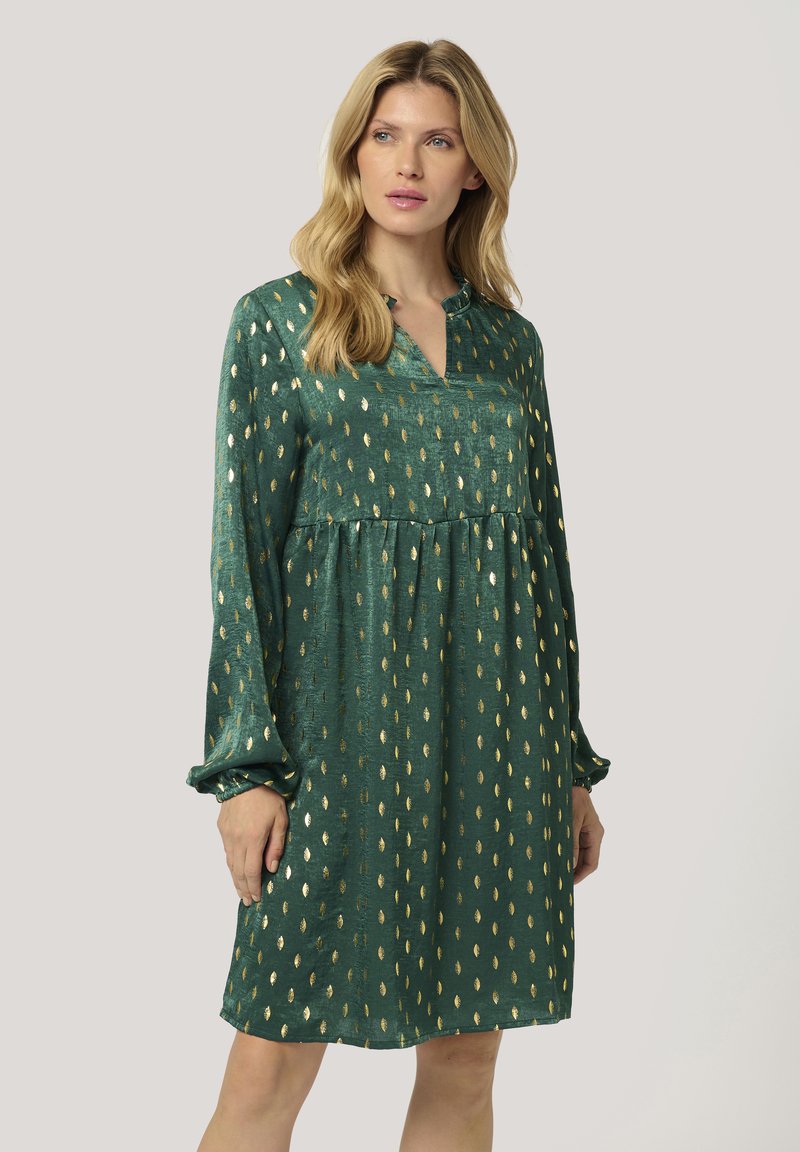 Grünes Kleid mit V-Ausschnitt, langen Puffärmeln und goldenen Blättern. Hergestellt aus einem strukturierten Stoff mit einer lockeren Silhouette und gerafftem Taillenbereich.