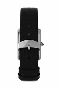 Must mustripa musta nahast hõbedase metallist lukuga ja varustusega. Omab mitmeid auke reguleerimiseks ja tekstuurset pinda. Brändi nimi "Timex" on graveeritud.