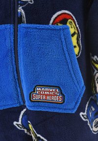 Fleece jacket featuring a navy base with superhero patterns. Bright blue pocket with an embroidered "MARVEL COMICS SUPER HEROES" patch.