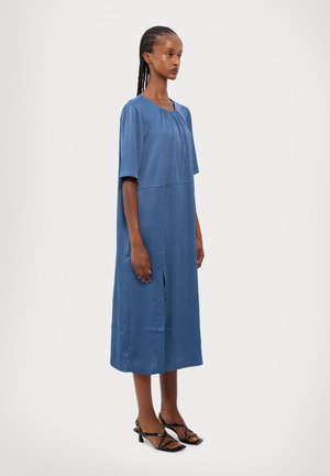 Blue, knee-length dress with a relaxed fit, short sleeves, and gathered neckline. Features a vertical slit at the front and textured fabric.