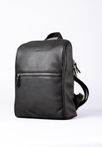 Black leather backpack with a smooth texture, rectangular shape, front zipper pocket, and adjustable straps. Features a subtle logo.