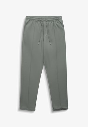 Pantalones grises de corte cónico con cintura elástica, cordón ajustable, bolsillos laterales, pliegue frontal y bajos con puños.