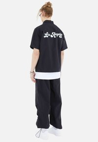 Megaman FREIZEI SET - Trousers - schwarz