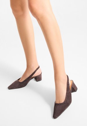 Brown suede slingback heels with a pointed toe and a low block heel, featuring an open back and a smooth texture.