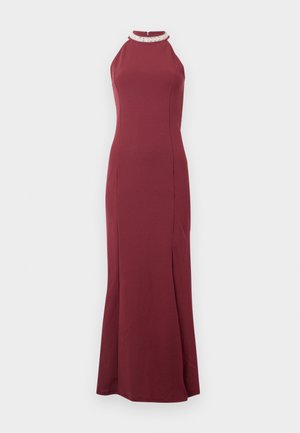 Sleeveless burgundy evening gown with jeweled high neckline and fitted silhouette, featuring a side slit.