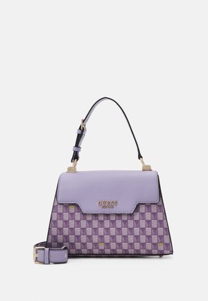 Purple and lavender GUESS handbag with checkered pattern, gold logo, adjustable top handle, and detachable shoulder strap on white background.