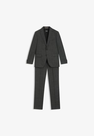 Completo a due pezzi in tessuto grigio scuro con una sottile texture. Giacca monopetto e pantaloni con gamba dritta, caratterizzati da un design slim fit.