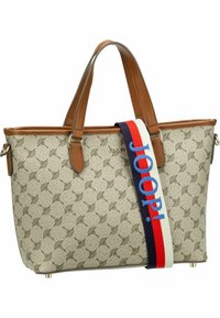 Beige kuvioitu olkalaukku ruskeilla nahkaosilla ja kahvoilla. Varustettu värikkäällä, logolla varustetulla hihnalla ja metallijaloilla pohjassa.