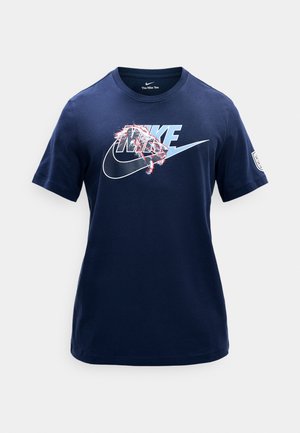 Navy blue Nike T-shirt with light blue and white logo and graphic of a lion's head on the chest, short sleeves, and round neck.
