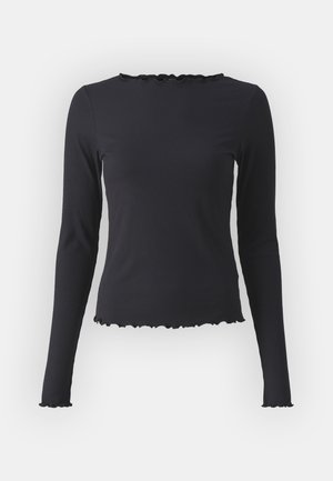 Mustaard ribbed pikkade varrukatega topp, millel on lühem ääreosa ja volangiga kaelus. Valmistatud venivast kangast mugavuse ja sobivuse tagamiseks.