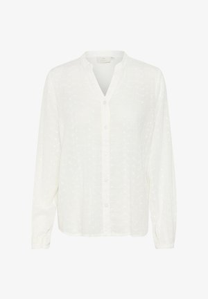 Valge, pika varrukaga pluus, millel on V-kaelus, nupupaneering ja tekstureeritud kangas, mis sisaldab kogu ulatuses väikeseid augukesi.