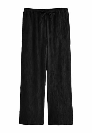 Czarne spodnie o szerokich nogawkach z pofałdowaną fakturą oraz elastycznym paskiem w talii z wiązanym troczkiem.