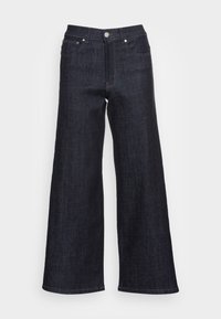 Calças de ganga largas de cor azul-escuro com um acabamento ligeiramente texturizado, apresentando um fecho de botão na frente e costura em contraste nos bolsos.