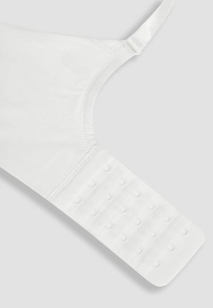 Balts krūšturis ar gludu audumu, regulējamām siksnām un daudzpunktu aizdari uz jostas, lai pielāgotu izmēru.