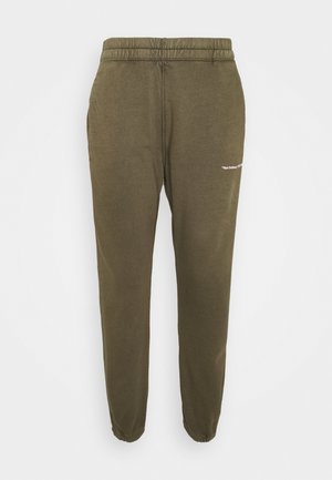 Olijfgroene, taps toelopende joggingbroek met een elastische tailleband en geribbelde broekspijpen. Voorzien van een klein wit tekstlogo aan de zijkant. Zacht materiaal.