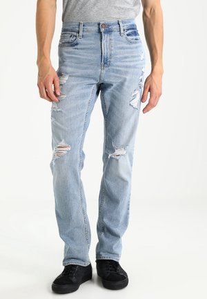 Jeans a sigaretta - destroyed denim