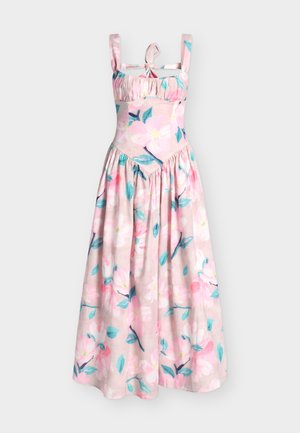 Robe maxi rose sans manches à imprimé floral bleu et blanc, taille froncée, encolure carrée et détail noué à l'avant sur les bretelles.