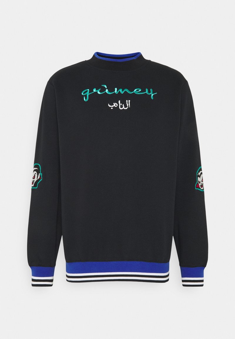 Sweat-shirt noir à col haut, avec texte brodé turquoise et blanc "grimey" et inscription en arabe, ainsi que des accents à motifs sur les manches.