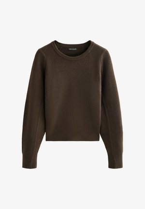 Brun ribbet striktrøje med rund halsudskæring og raglanærmer. Har en cropped længde og struktureret stof. Ingen synlige lukninger.