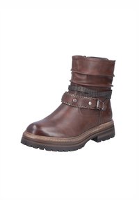 Brown leather ankle boot with a slouched design, decorative straps, metal buckle, and textured accents. Thick rubber sole for traction.
