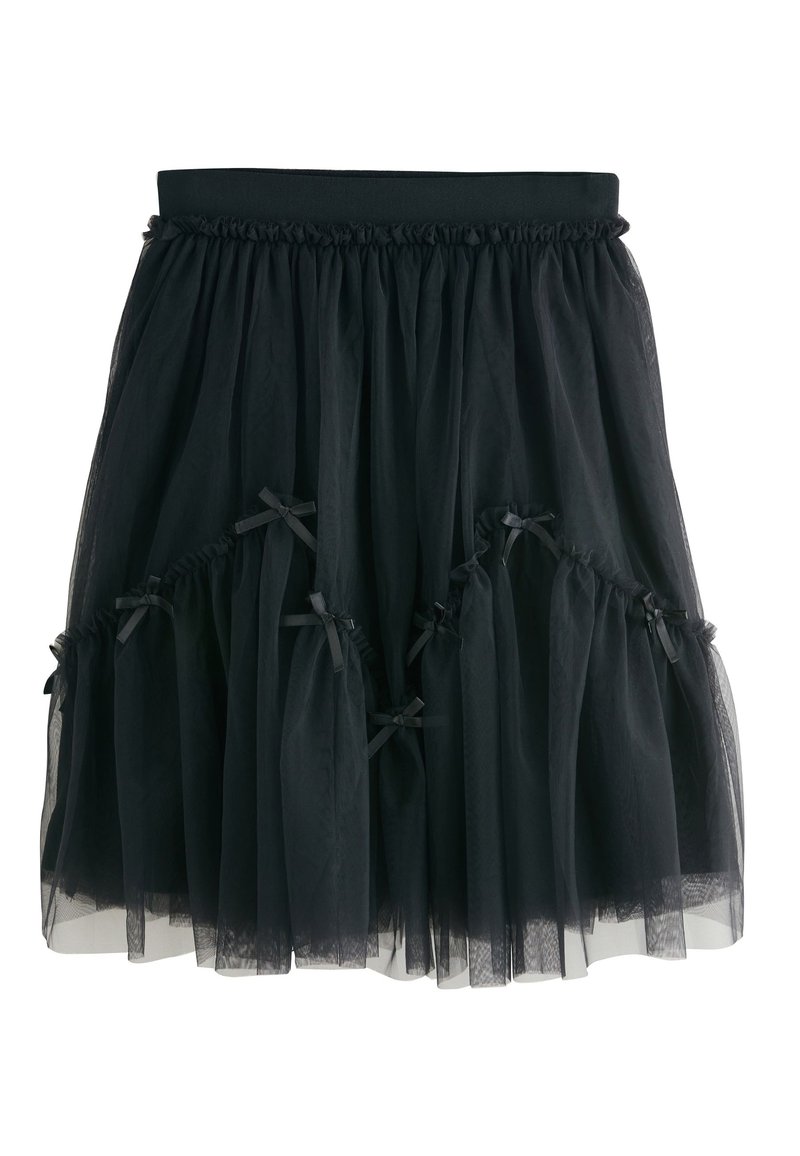 Gonna in tulle nero con elastico in vita, caratterizzata da strati arricciati e piccoli dettagli in nastro nero lungo l'orlo e i lati.
