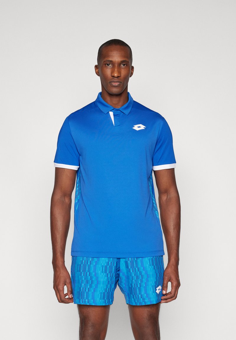 Blue polo shirt with short sleeves, white collar, and logo. Paired with blue patterned shorts. Smooth texture and athletic fit.
