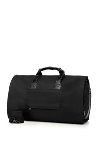 Schwarze Canvas-Duffel-Tasche mit Lederakzenten, ausgestattet mit zwei Griffen, einem abnehmbaren Schulterriemen und einer Fronttasche zur Aufbewahrung.