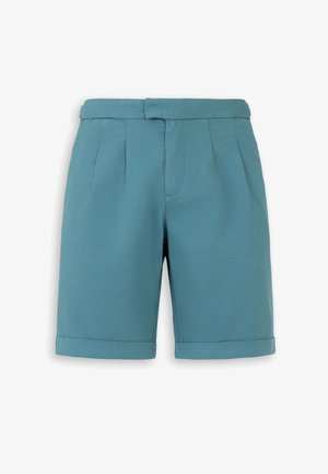 Shorts bleu sarcelle longueur genou avec ourlets repliés, plis sur le devant, et fermeture zippée dissimulée avec ceinture à la taille.
