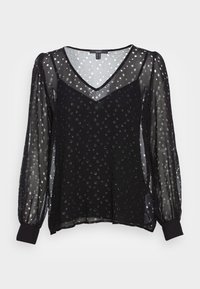 Schwarze transparente Bluse mit langen, gerafften Ärmeln und V-Ausschnitt, verziert mit silbernen Punktmustern und einem einfarbigen schwarzen Saum. Das leichte Material verleiht der Bluse Textur.
