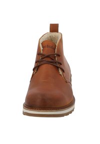 Braune Leder-Ankle-Boots mit abgerundetem Zehenbereich, Schnürdesign, Lammfellfutter und weißer Gummisohle. Verfügt über dezente Markenkennzeichnung an der Seite.