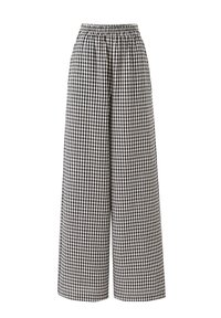 Hoge taille wijde broek met zwart-wit geblokt patroon en elastische tailleband op een witte achtergrond.