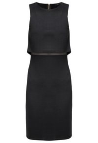 Robe noire avec un haut court sans manches et une partie inférieure ajustée. Fabriquée en tissu lisse, dotée d'une fermeture éclair à l'arrière.