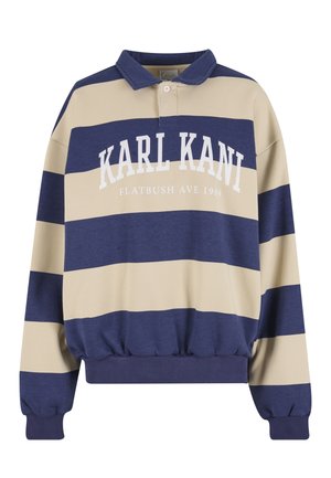 Námornícka modrá a béžová pruhovaná mikina s golierom, s bielym nápisom "KARL KANI FLATBUSH AVE 1989" na prednej strane. Textúrovaný materiál.