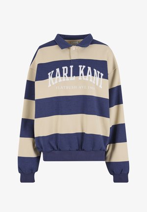 Námornícka modrá a béžová pruhovaná mikina s golierom, s bielym nápisom "KARL KANI FLATBUSH AVE 1989" na prednej strane. Textúrovaný materiál.