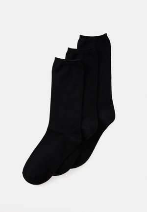 Chaussettes noires dans un paquet de trois, avec une texture lisse, des poignets côtelés et un design classique sans motifs ni embellissements.