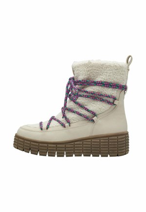 Beige ankelboots med en faux fur-krage, lila och gröna flätade snören och en texturerad brun plattformssula. Mjukt, slätt material.