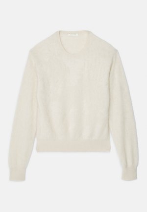 Kreemjat värvi pikka varrukaga karvane kampsun ribadega mansettide ja alläärega, ümmargune kaelus ning diskreetne logo broderi vasakul varrukal.