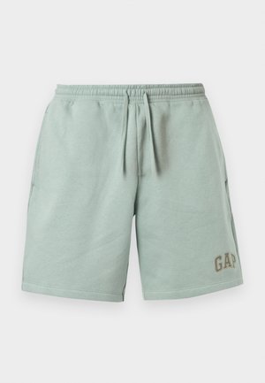 Svetlo zelene sproščene kratke hlače z elastičnim pasom, vrvico za zavezovanje, stranskimi žepi in logotipom GAP na spodnjem desnem delu noge.