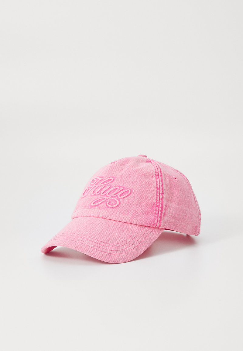 Pink baseball cap made of soft fabric, featuring embroidered "Hugo" text on the front, with curved brim and stitched accents.