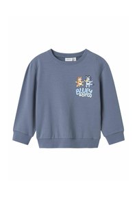 Sinine dressipluus pehmest kangast, ümmarguse kaelusega ja pikkade varrukatega. Esipaneelil on kahe koomiksitegelase trükitud kujundus.