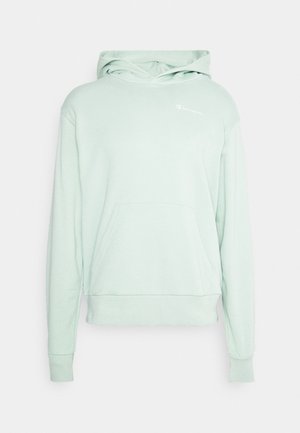 Vaaleanvihreä huppari, joka on valmistettu pehmeästä kankaasta. Hupparissa on etutasku, nyörillä varustettu huppu ja pieni valkoinen logo vasemmassa rinnassa.