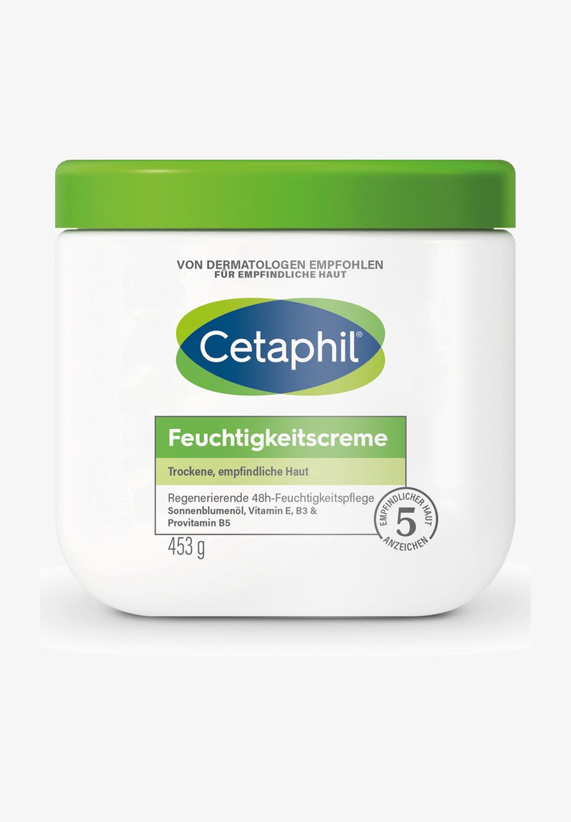 Cetaphil Feuchtigkeitscreme für trockene, empfindliche Haut mit Sonnenblumenöl, den Vitaminen E, B3, Provitamin B5, in einem weißen Tiegel mit grünem Deckel, 453 g.