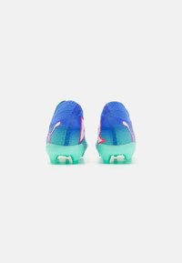 Football boots featuring a blue and turquoise design with mesh texture, prominent branding, and a semi-transparent sole.