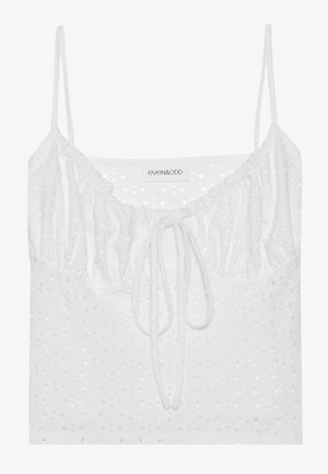 Valge ilma varrukateta top, millel on kogutud kaelus, sidumisdetail ja tekstuurne kanga aukudega muster. Brändi silt: even&odd.