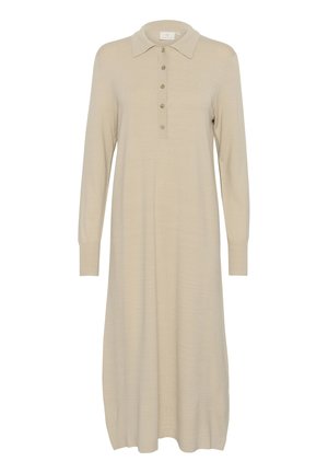Abito polo beige a maniche lunghe realizzato in morbido tessuto a maglia, caratterizzato da una scollatura a bottoni e una vestibilità comoda con orlo leggermente svasato.