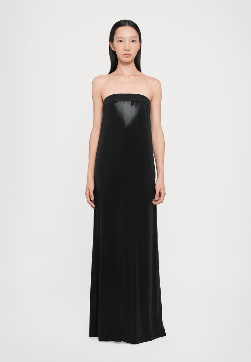 Black strapless maxi dress with a smooth, shiny texture and a fitted bodice, falling straight to the floor. Simple design, no patterns or embellishments.