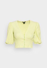 Blusa cropped amarelo claro com mangas bufantes, decote em V e fecho de botão, apresentando botões em forma de coração. Tecido texturizado com um acabamento suave.