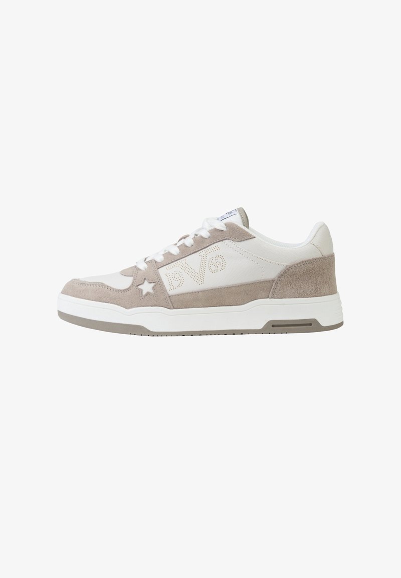 White and beige suede low-top sneaker with white laces, perforated “DVO” logo, star detail, and rubber sole.