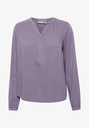 Dlhý rukáv blúzky v svetlofialovej textúrovanej tkanine s výstrihom do V a rovnými okrajmi. Obsahuje jednoduché švy a naťahovacie manžety.